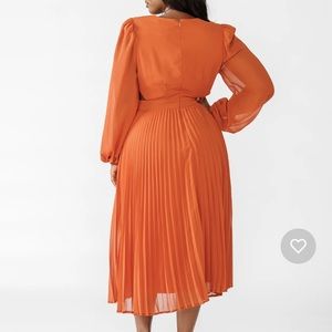 New! Never worn! Pleat detailing in the skirt, cut out on the side dress.